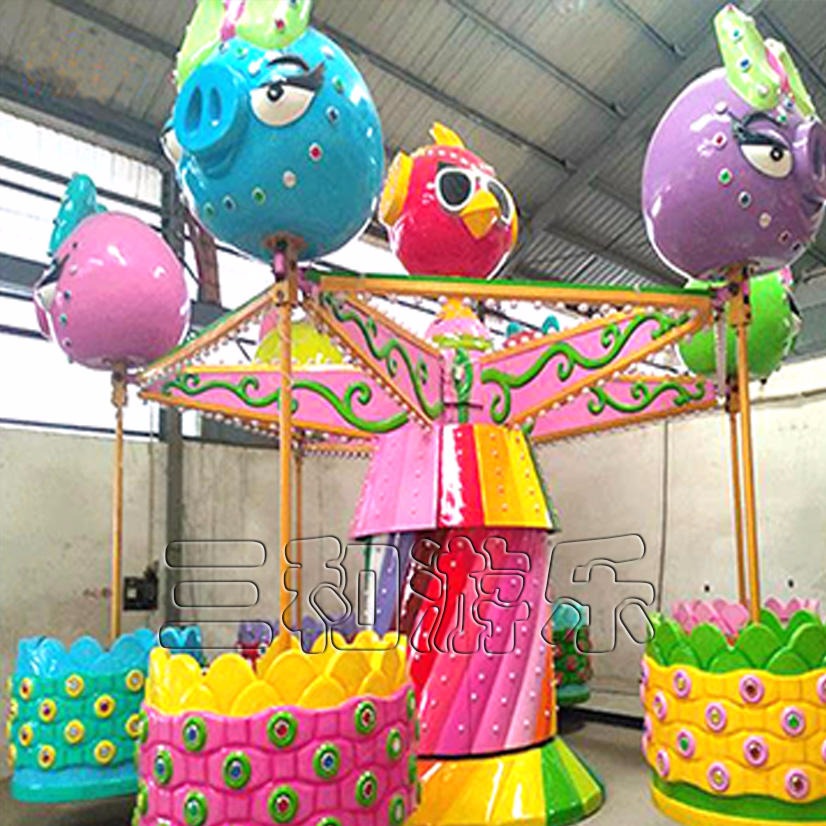 新款猪猪侠桑巴气球出售  升级款摇头飞椅造型  户外亲子类游乐设施图片